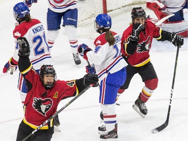 Calgary Inferno's Zoe Hickel (bottom left) celebrates after scoring her team's opening goal against Les Canadiennes Montreal during the first period of the 2019 Clarkson Cup game in Toronto, on Sunday, March 24, 2019.