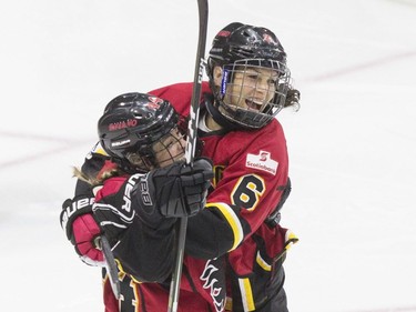 Calgary Inferno's Zoe Hickel (left) celebrates with Rebecca Johnston after scoring her team's fourth goal against Les Canadiennes de Montreal, during third period action in the 2019 Clarkson Cup game in Toronto, on Sunday, March 24 , 2019.
