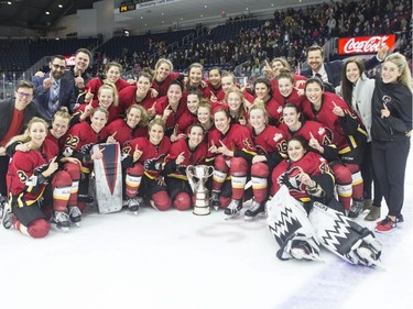 Calgary Inferno players celebrate with the trophy after beating Les Canadiennes de Montreal 5-2 to win the 2019 Clarkson Cup game in Toronto, on Sunday, March 24 , 2019.