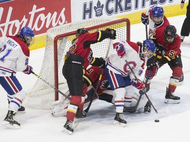 Les Canadiennes de Montreal's Sarah Lefort (centre) tries to put the puck past Calgary Inferno's goaltender Alex Rigsby during second period action in the 2019 Clarkson Cup game in Toronto, on Sunday, March 24 , 2019.