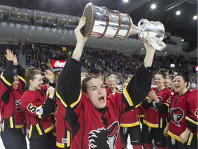 Calgary Inferno's Blayre Turnbull hoists the trophy after her team beat Les Canadiennes de Montreal 5-2 to win the 2019 Clarkson Cup game in Toronto, on Sunday, March 24 , 2019.