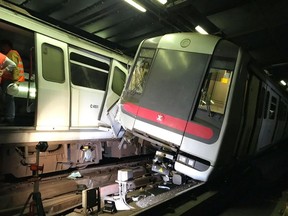 In this photo released by MTR Corporation, two MTR trains sit after collision on the Tsuen Wan Line during testing of the rail company's new signal system in Hong Kong Monday, March, 18, 2019. Two Hong Kong subway trains collided in early hours on Monday, leaving one train driver suffered leg injury and the other felt unwell after inhaling smoke. It cause service suspensions between affected stations. (MTR Corporation via AP) ORG XMIT: XKC802