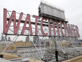 The iconic Watchtower sign is seen on the roof of 25-30 Columbia Heights, then world headquarters of the Jehovah's Witnesses, in the Brooklyn borough of New York. A Quebec Superior Court judge has authorized a class-action lawsuit for current or former Jehovah's Witnesses in Quebec who were sexually abused by other members as minors.