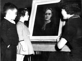 Portrait of the Montreal teacher who lost her life in a school fire in 1907 is admired on March 5, 1953, by two pupils and a staff member of the Sarah Maxwell Public School in Montreal North, Richard Spencer (left) Wendy Swanson and Miss June Fisher. Published March 6, 1953.