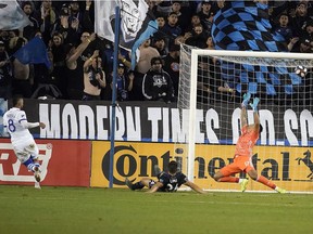 Montreal Impact midfielder Saphir Taider (8) scores a goal over San Jose Earthquakes goalkeeper Daniel Vega (17) during the first half of an MLS soccer match in San Jose, Calif., Saturday, March 2, 2019.