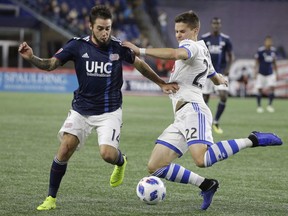 New England Revolution's Diego Fagundez, left, and Montreal Impact's Jukka Raitala, right, vie for control of the ball during the second half on Oct. 28, 2018, in Foxborough, Mass.