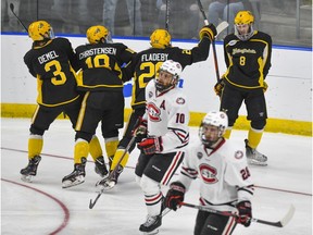 American International College players celebrate a goal during their 2-1 upset win over St. Cloud State Friday night in Fargo, N.D.