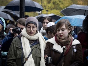 Sarah Abdelshamy, left, and Tali Ioselevich, during a memorial for the victims of the shooting at the Tree of Life congregation in Pittsburgh Pennsylvania. The service was held in Montreal on Sunday October 28, 2018
