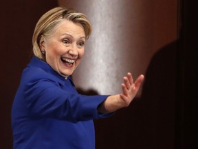 In this Jan. 7, 2019, file photo, former Secretary of State Hillary Clinton waves to well-wishers following an appearance at Barnard College with New York Gov. Andrew Cuomo, in New York.