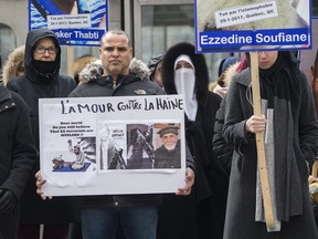 People attend a vigil in Montreal on Sunday to remember the 50 people killed at a mosque in New Zealand last week as well as the six who died in a Quebec City mosque shooting two years ago.
