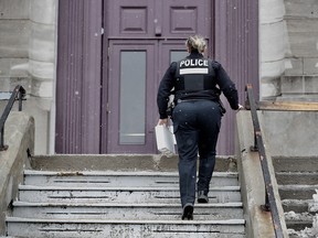 Montreal police officers at the scene of a stabbing at St. Joseph's Oratory March 22, 2019. Father Claude Grou is in stable condition.