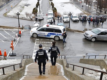 Montreal police officers at the scene of a stabbing at St. Joseph's Oratory March 22, 2019. Father Claude Grou is in stable condition.