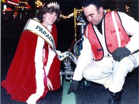 Published on Page 1 of the Montreal Gazette March 15, 1985: St. Patrick's Day Parade queen Carolyn Byrne gives city worker Sante Paolino royal approval for green line being painted on St. Catherine St. for Sunday's big affair.