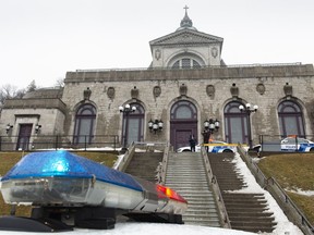Police cars surround the St. Joesph's Oratory in Montreal on Friday, March 22, 2019. A Catholic priest was stabbed as he was celebrating mass this morning at the Oratory.
