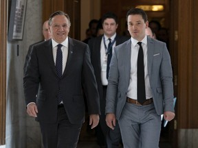 Quebec Premier François Legault, left, and Quebec Minister of Immigration, Diversity and Inclusiveness Simon Jolin-Barrette are calling for a reasonable, rational debate on the religious symbols bill.
