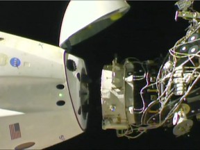 In this image taken from NASA Television, SpaceX's swanky new crew capsule undocks from the International Space Station Friday, March 8, 2019. The capsule undocked and is headed toward an old-fashioned splashdown. The Dragon capsule pulled away from the orbiting lab early Friday, a test dummy named Ripley its lone occupant. (NASA TV via AP) ORG XMIT: TKTT103