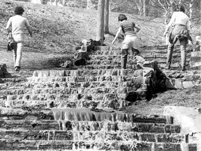 In this photo published March 26, 1979, strollers make their way up Mount Royal near Peel and Pine after spring run-off had turned the stairs there into a waterfall.