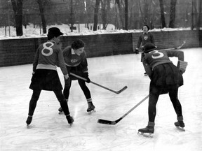 In a photo dated March 9, 1940, women play hockey at McGill University. The women in the foreground are referee Jean Buchanan, Freda Wales and Margie Copping.