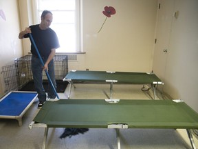 Stephane Houle cleans up one of the rooms available for homeless people at the old Royal Victoria hospital in January 2019.