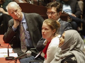 Charles Taylor, left, co-author of the Bouchard-Taylor recommendations on reasonable accommodations, listens as high school teacher Nadia Naqvi, right, speaks at McGill University Faculty of Law Moot Court in a panel discussion on the CAQ's religious symbols bill. Also on the panel are Robert Leckey, Dean of the McGill University Faculty of Law and Catherine McKenzie, Counsel on Bill 62 challenge.