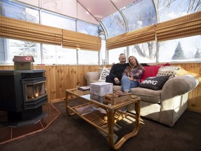 Lori Rubin and Marty Wise in the solarium of their home in Dollard.