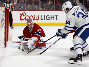 Canadiens goaltender Charlie Lindgren dives to cover up as Toronto Maple Leafs centre Auston Matthews hunts for puck on April 6, 2019.