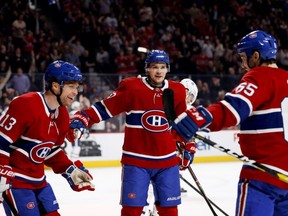 Canadiens' Max Domi, from left, Artturi Lehkonen and Andrew Shaw celebrate after scoring against the Toronto Maple Leafs on April 6, 2019.