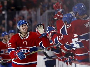 Canadiens' Ryan Poehling celebrates scoring a hat trick against the Toronto Maple Leafs during his NHL debut in Montreal on Saturday, April 6, 2019.