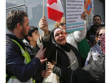 A woman is overcome with emotion at Place Émilie-Gamelin in Montreal on Sunday, April 7, 2019, at a demonstration to denounce the Quebec government's Bill 21.