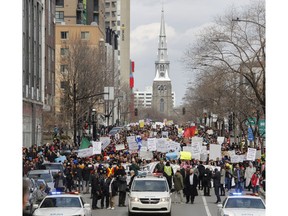 Thousands march on René Lévesque Blvd. in Montreal on Sunday, April 7, 2019, to denounce the Quebec government's Bill 21.