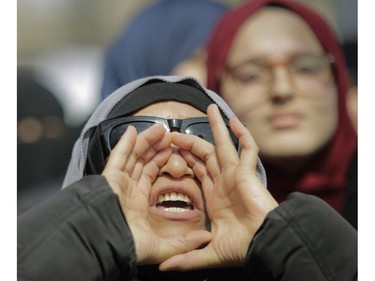 A woman yells at Place Émilie-Gamelin in Montreal Sunday, April 7, 2019 at a demonstration to denounce the Quebec government's Bill 21. The Canadian Collective Anti- Islamophobia (CCAI) called for people to come out to protest the CAQ government's  secularism bill which they say is "... discriminatory and undermines the fundamental rights of religious minorities in Quebec, particularly Muslim women wearing the hijab." (John Kenney / MONTREAL GAZETTE) ORG XMIT: 62358