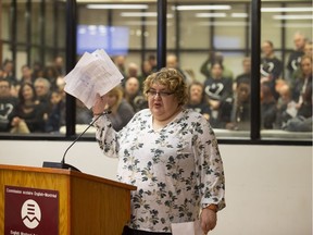 Speaking at the English Montreal School Board on April 10, a Galileo student shows signatures she collected that support leaving the classes where they are. (Christinne Muschi / MONTREAL GAZETTE)