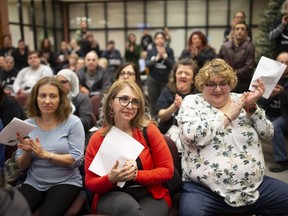 Parents, students and staff attend a meeting at the English Montreal School Board office in Montreal on Wednesday night.