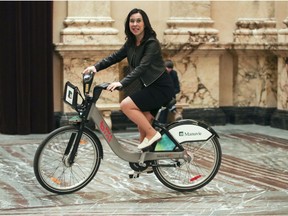 Montreal Mayor Valérie Plante takes a Bixi for a spin around the Hall of Honour at Montreal city mall on Friday.