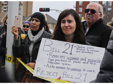 Julia Marsiglio and others listen to speakers at a Rally For Religious Freedom and against the CAQ government's Bill 21 in Côte-St-Luc on Sunday, April 14, 2019. Bill 21 proposes public employees, including teachers, judges and police officers, would be barred from wearing symbols of faith.