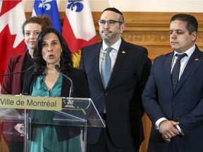 Montreal Mayor Valérie Plante and city councillor Lionel Perez, leader of the Ensemble Montreal opposition party, joined by executive committee member Rosannie Filato and Ensemble Montreal councillor Abdelhaq Sari, right, delivered a joint statement denouncing Bill 21, the Quebec governments's controversial proposed law governing religious neutrality, at City Hall in Montreal Monday April 15, 2019.