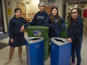 Kingsdale Academy students, from left, Savana Gaetano, Presley Cleaveland, Aria Piggins and Rylee Lanni help gather and sort school waste. One of the Pierrefonds school's ongoing initiatives is to help protect the environment.