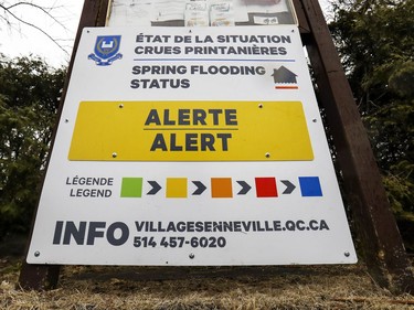 Signs indicate the level of flood risk in the town of Senneville, west of Montreal, April 18, 2019.