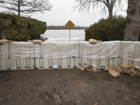 A flood barrier is in place at the foot of de Gaulle St. in the Pierrefonds-Roxboro borough Thursday April 18, 2019.