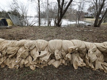 A row of sandbags line a property on de Gaule St. in the Pierrefonds-Roxboro borough of Montreal Thursday April 18, 2019.