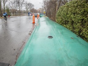 Barriers were in place alongside Rive-Boisée Rd. in Pierrefonds Friday, in preparation of expected flooding from Rivière des Prairies.