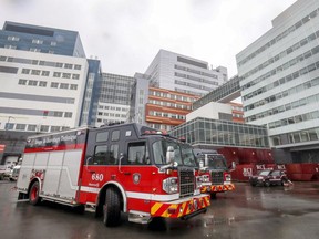Fire trucks parked at the back of the Royal Victoria Hospital and the MUHC Research Institute in Montreal on Wednesday.