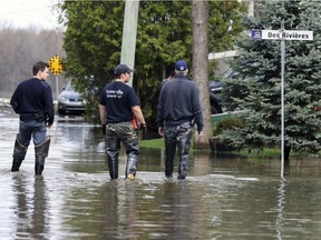 Firefighters are seen here checking on residential pumps in the Pierrefonds-Roxboro borough during the spring 2017 floods.