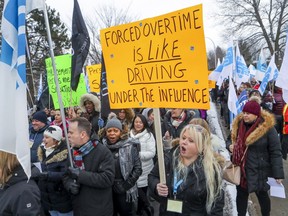 Members of the Federation interprofessionelle de la santé du Québec demonstrated outside the Lakeshore General Hospital in Pointe-Claire in December, urging the government to limit overtime.
