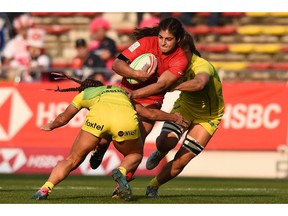 Bianca Farella of Canada is tackled during the pool match between Australia and Canada on day one of the HSBC Women's Rugby Sevens Kitakyushu at Mikuni World Stadium on Saturday, April 20, 2019, in Kitakyushu, Fukuoka, Japan.