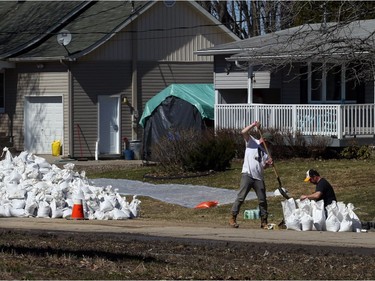 Volunteers fill sand bags to help battle the flooding  Ottawa River is flooding near Boisé Rd. in Cumberland, just east of Ottawa, April 22, 2019.