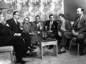 Members of the Maple Leaf Pipe Smoking Club are shown in this 1954 photograph with what was described as the world's "only known electric pipe." The seven men are, from left, Leslie Greene, Herky Levine, Bernard Roland, Alfred Burchmore, Roger Rocheleau, Mel Greene and Gerson Hecht.