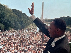 In this Aug. 28, 1963 file photo, The Rev. Martin Luther King Jr. waves to the crowd at the Lincoln Memorial for his "I Have a Dream" speech during the March on Washington. The march was organized to support proposed civil rights legislation and end segregation.