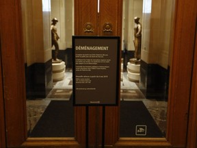 A sign at the front entrance of Montreal city hall informs visitors that the building will be closed for renovations as of Monday, May 6, and directs them to the Lucien Saulnier building at 155 Notre-Dame St. E.