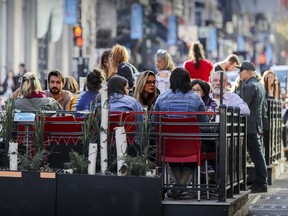 Montrealers dine and drink on a terrasse